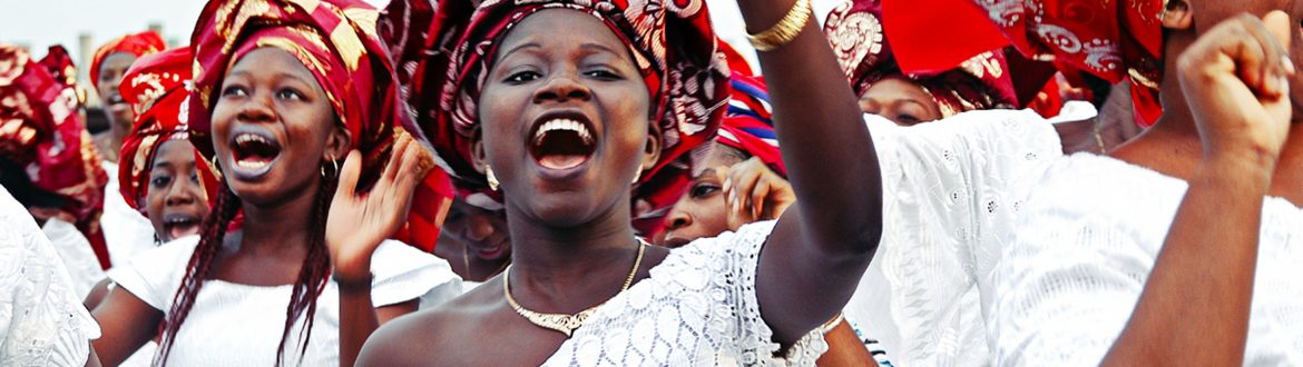 A group of worshippers singing into microphones